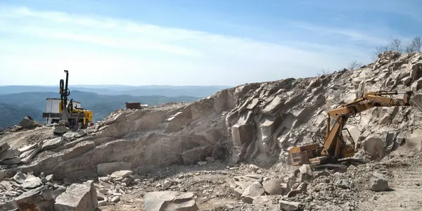 A large rock formation with a sky background